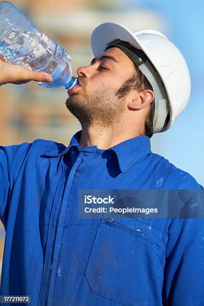 Replenishment After A Long Day Stock Photo - Download Image Now - Construction Worker, Drinking, Occupation