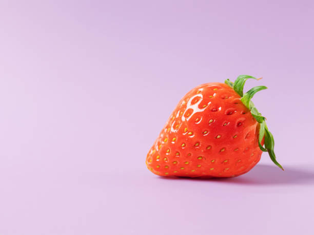 istock One strawberry on a primary color background 1772121063