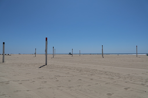 Wooden beach pole along the Dutch coast of the Wadden island of Ameland, Netherlands