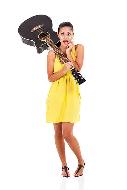 istock surprised young woman with a guitar 177219853