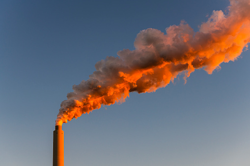 smoke and steam from a factory chimney