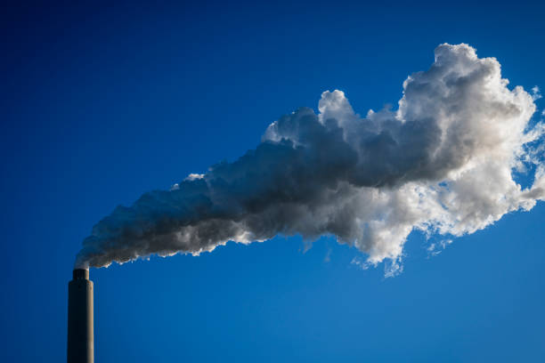 smoke and steam from a factory chimney