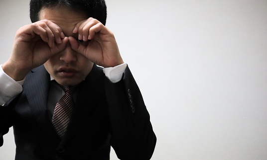 Close-up photo of Japanese businessman posing