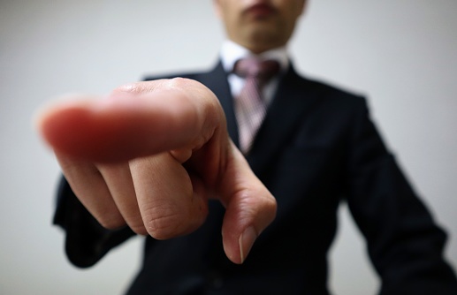 Close-up photo of a businessman giving instructions