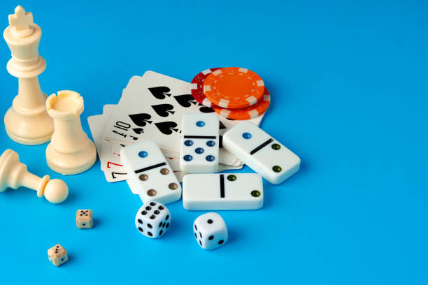 istock Items for playing chess, poker and domino on blue background studio shot 1772227890