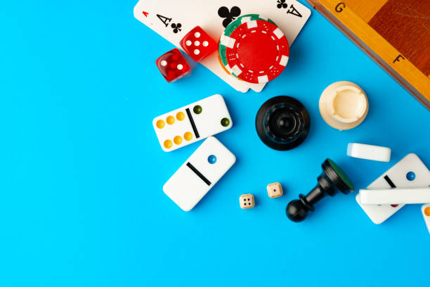 istock Items for playing chess, poker and domino on blue background studio shot 1772235578