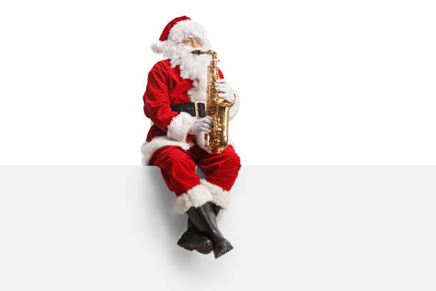 istock Santa Claus playing saxophone and sitting on a wall 1772235587