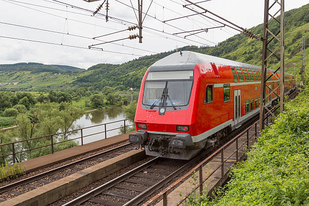 istock Train driving along river Moselle in Germany 177223736