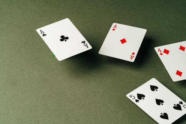 istock Playing cards on green background studio shot 1772250698