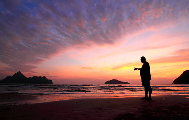 istock young man and sunset on sea 177226161