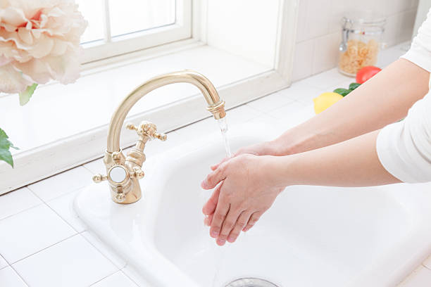 Women to hand washing stock photo