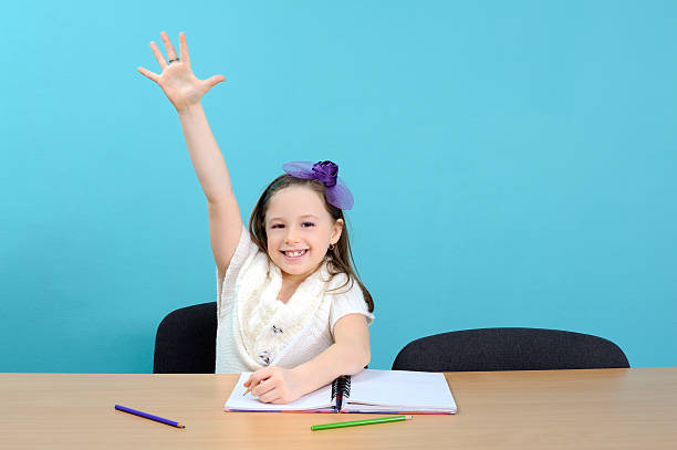 istock Happy school girl in classroom 177226849