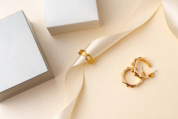 istock Golden jewelry ring on ribbon studio shot 1772274432