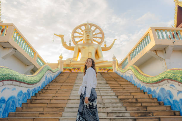 istock Cheerful woman exploring in Big Buddha Temple in Koh Samui 1772276137