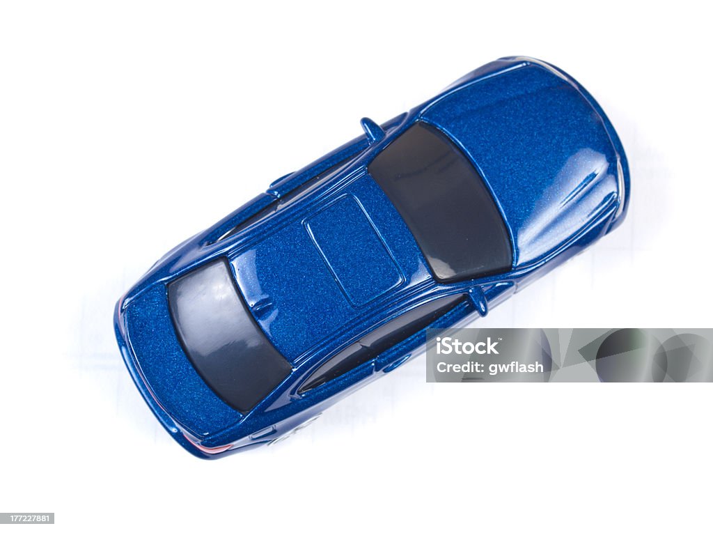 Coche de juguete en miniatura azul sobre fondo blanco - Foto de stock de Coche de juguete libre de derechos
