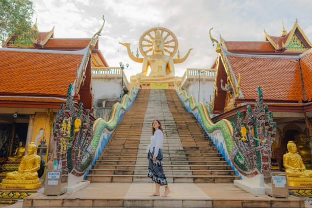 istock Cheerful woman exploring in Big Buddha Temple in Koh Samui 1772281031