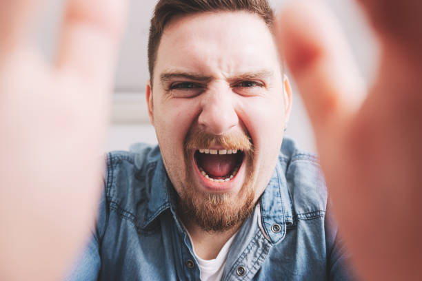 istock Angry Man Yelling Towards Camera, Expressing Frustration and Aggression 1772282087