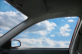 View of sky through window from inside car 