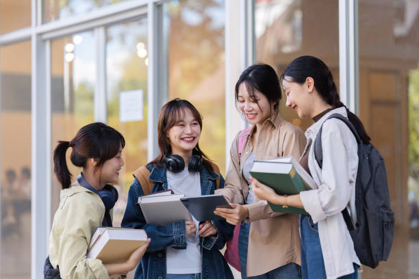 istock University students reading books and tutoring special class while walking to next class 1772285053