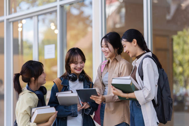 istock University students reading books and tutoring special class while walking to next class 1772285423