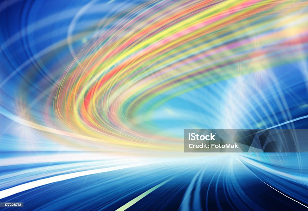 Abstract colorful lights in motion in blue highway tunnel Abstract speed motion in urban highway road tunnel, blurred motion toward the light. Computer generated colorful illustration. Light trails, fiber optics technology background. Fiber Optic Stock Photo