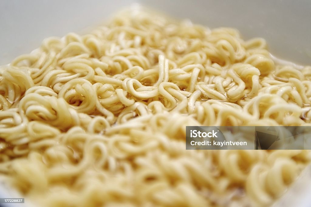 Instant noodles cooking Instant noodles are cooking in a white square bowl Asia Stock Photo