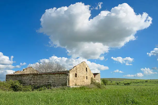 Photo of Clouds and ruined stable