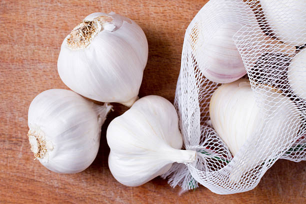istock garlic on wooden board 177229369