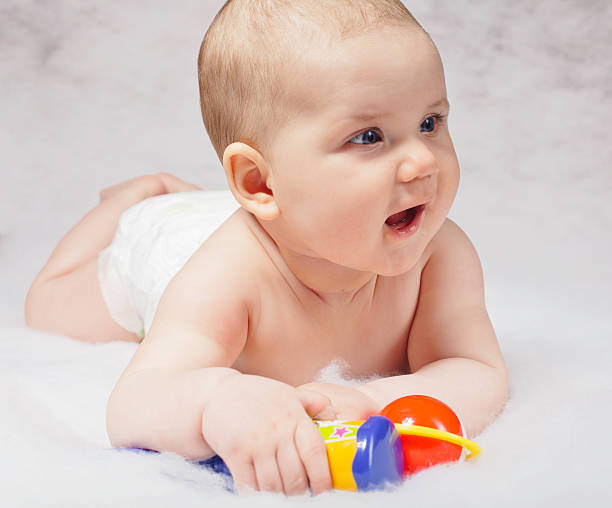 istock Smiling child playing with toys 177229473