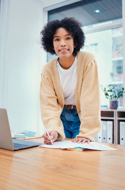istock Portrait of woman, notes and standing in office with admin, internet and creative ideas for freelance project. Remote work, writing on paperwork and girl at desk with research, agenda and happy face. 1772299344
