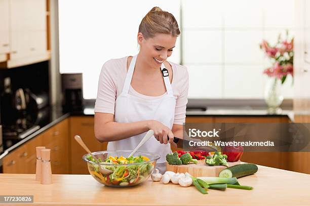 Woman Slicing Vegetables Stock Photo - Download Image Now - 25-29 Years, Adult, Adults Only