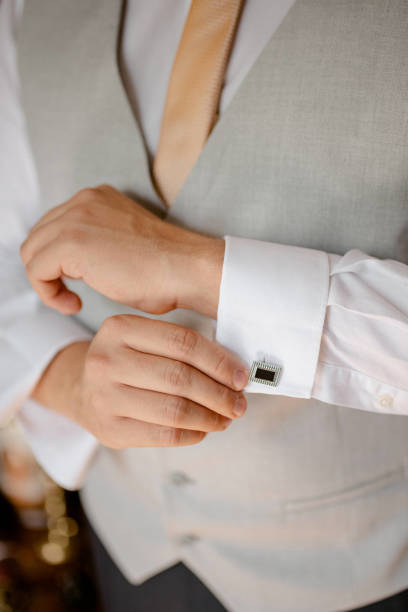 istock A young businessman is getting dressed for a meeting. 1772310067