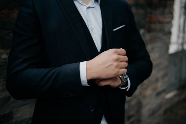 istock A young businessman is getting dressed for a meeting. 1772310592