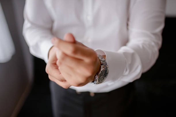 istock A young businessman is getting dressed for a meeting. 1772310604