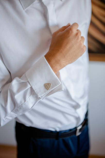 istock A young businessman is getting dressed for a meeting. 1772311184
