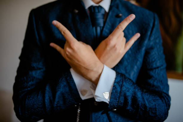 istock A young businessman is getting dressed for a meeting. 1772311729