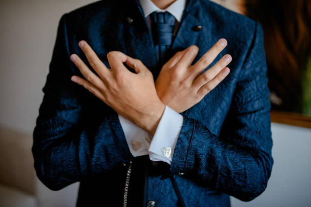 istock A young businessman is getting dressed for a meeting. 1772311730