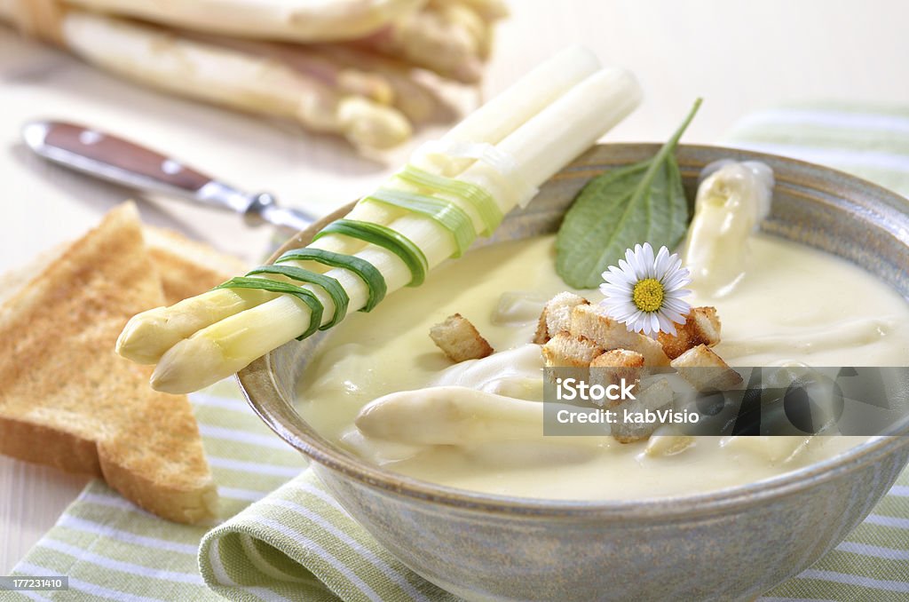 Cream of asparagus soup "Fresh cream soup of white asparagus, served with croutons and toast" Asparagus Stock Photo