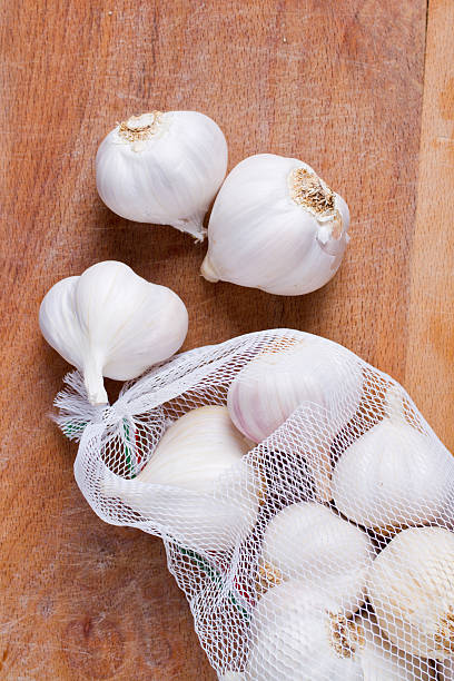 istock garlic on wooden board 177231796