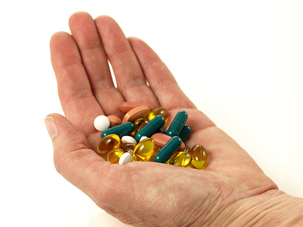 istock Handfull of pills, isolated 177231901