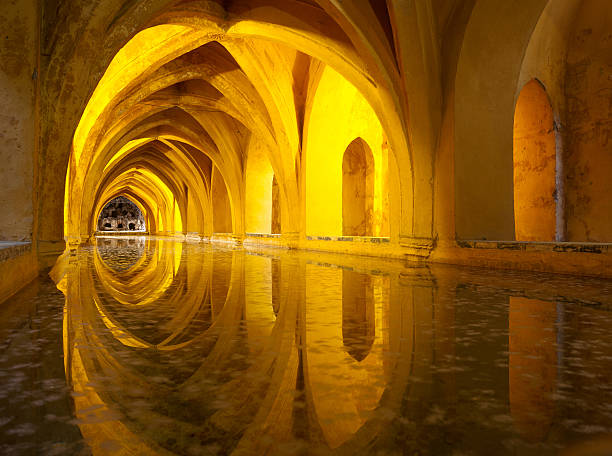 alcazar queen's bath, sevilla, andalusien, spanien - ancient arabic style arch architecture stock-fotos und bilder