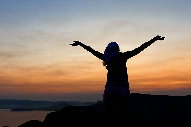 istock The woman on a mountain with open hands 177232773