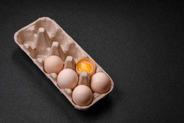 istock Raw chicken eggs in a box, cherry tomatoes, chickpeas, spices, salt and herbs 1772341115