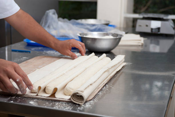 Baker preparing Baguettes stock photo