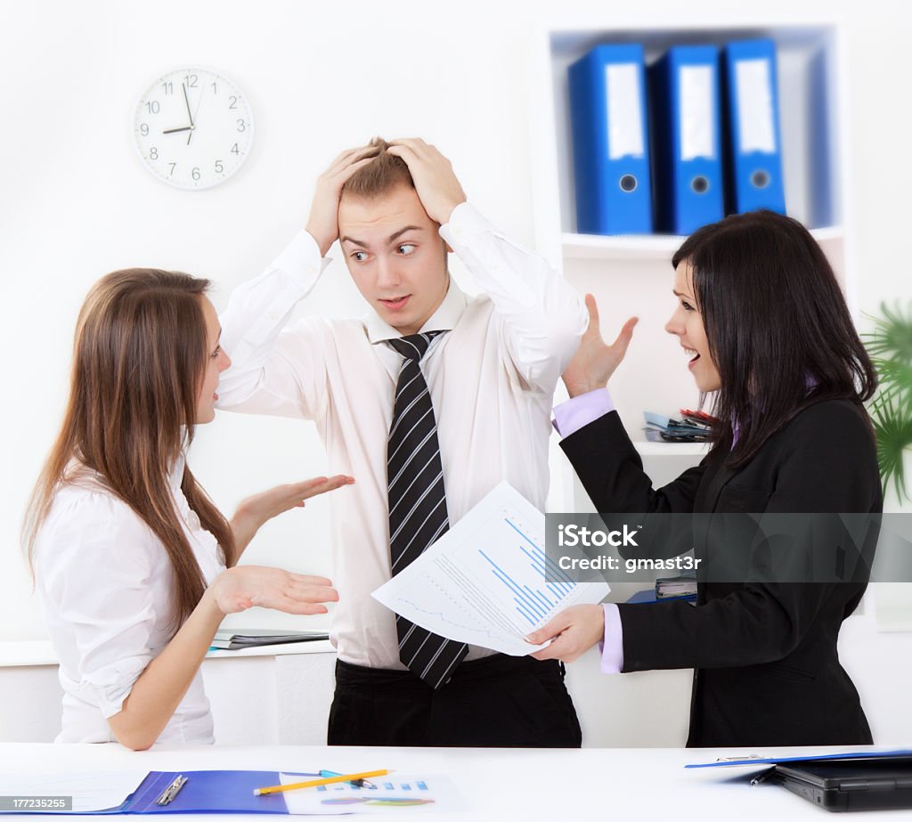 Office workers dealing with a dilemma at work young business people conflict problem working on project in team together, businessmen and women serious argument the financial diagram, graph, business charts, businesspeople meeting at desk office Accidents and Disasters Stock Photo