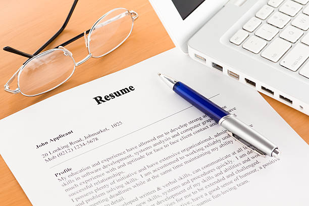 istock Resume with Pen by Laptop 177235627