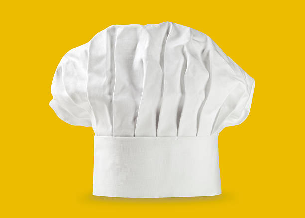 Chef hat or toque Chef hat or toque on yellow toque stock pictures, royalty-free photos & images