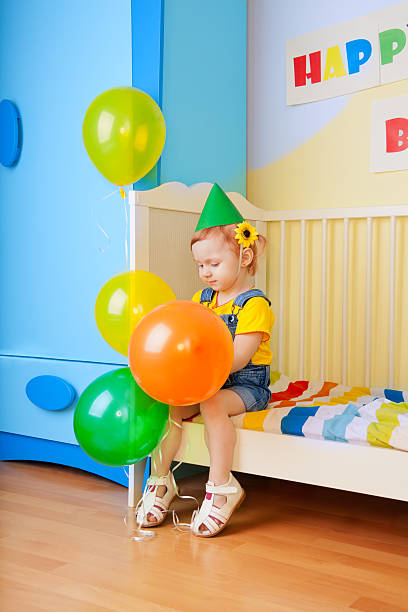 istock Little girl with balloons 177236451