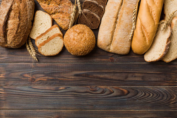 istock Homemade natural breads. Different kinds of fresh bread as background, top view with copy space 1772364704