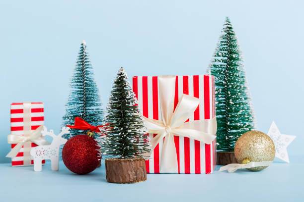 istock Christmas composition. craft Gift box, small tree, branches and craft DIY decorations on white background. New year concept. Christmas home decoration Flat lay, top view, copy space 1772365337